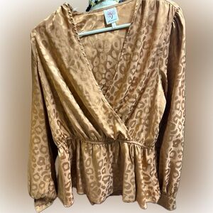 Pretty copperish tan animal print blouse